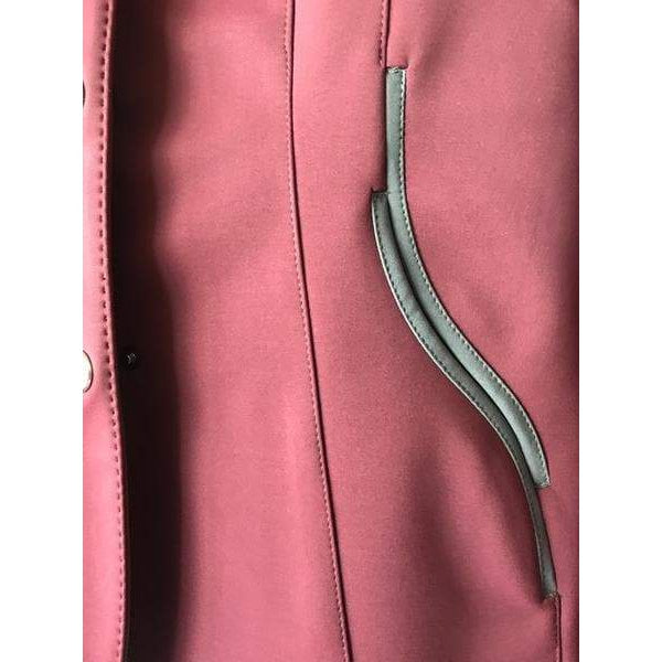 Animo brand jacket with unique zipper detail on pink fabric.