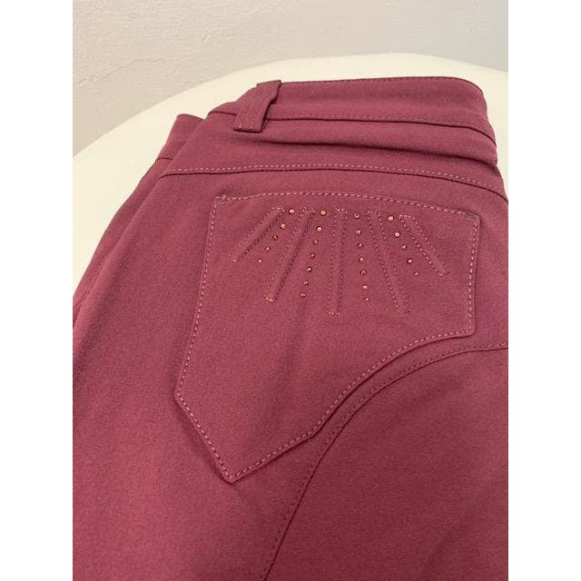 Animo brand burgundy breeches with studded pocket design detail.