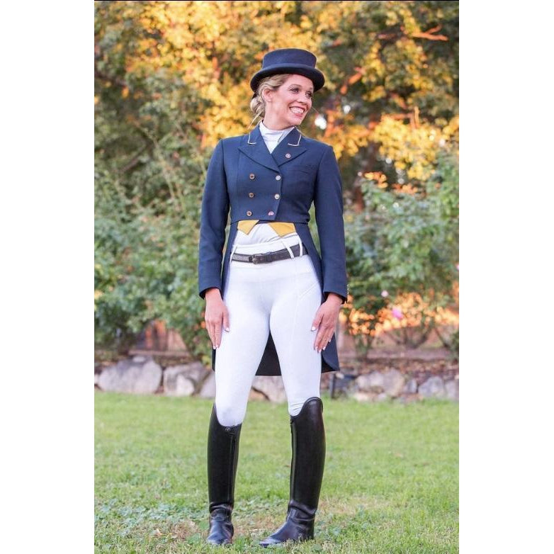 Woman in horse riding tights, jacket, top hat, and tall boots.