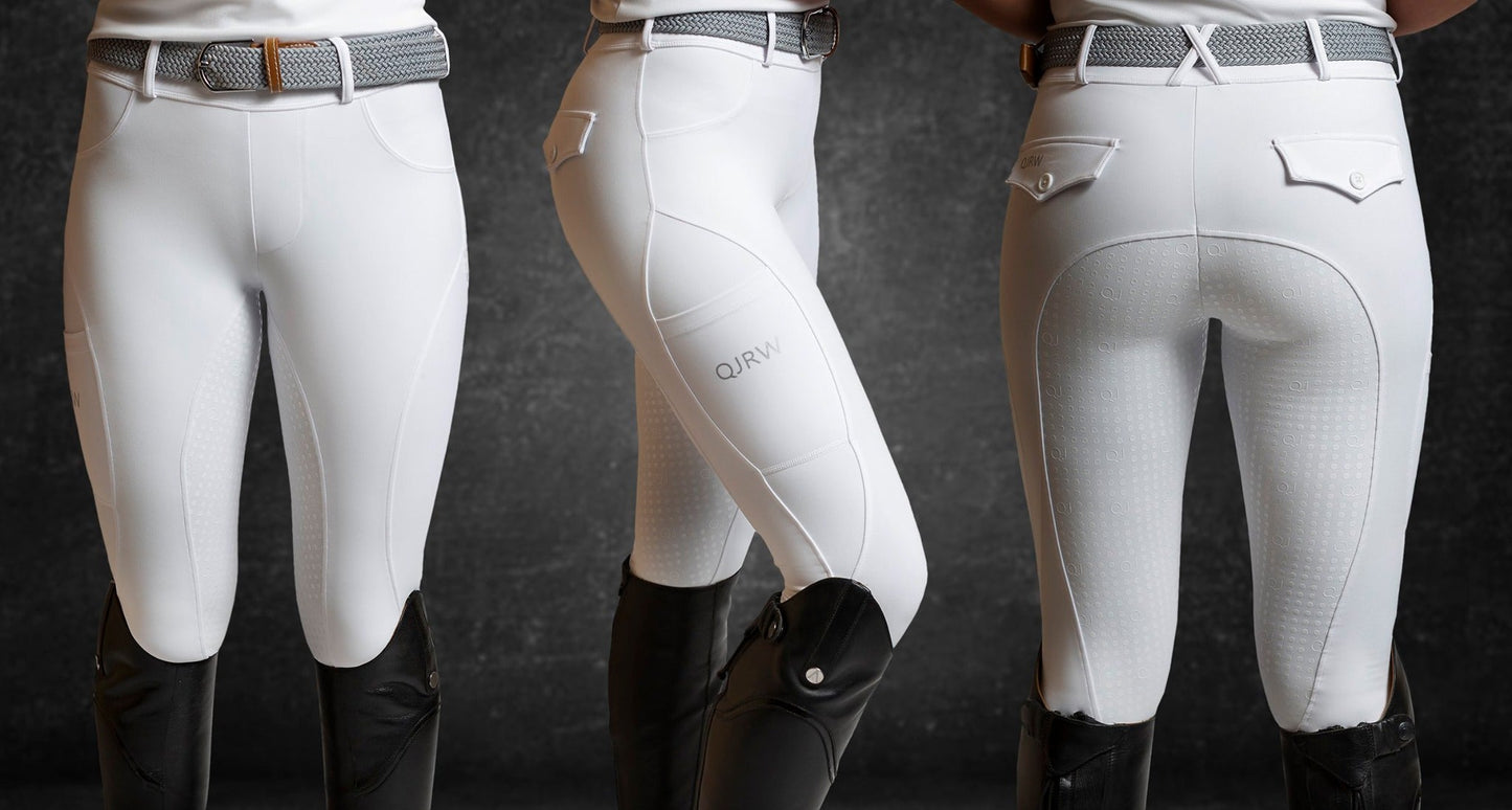 Three equestrians showcasing white horse riding tights against a grey backdrop.
