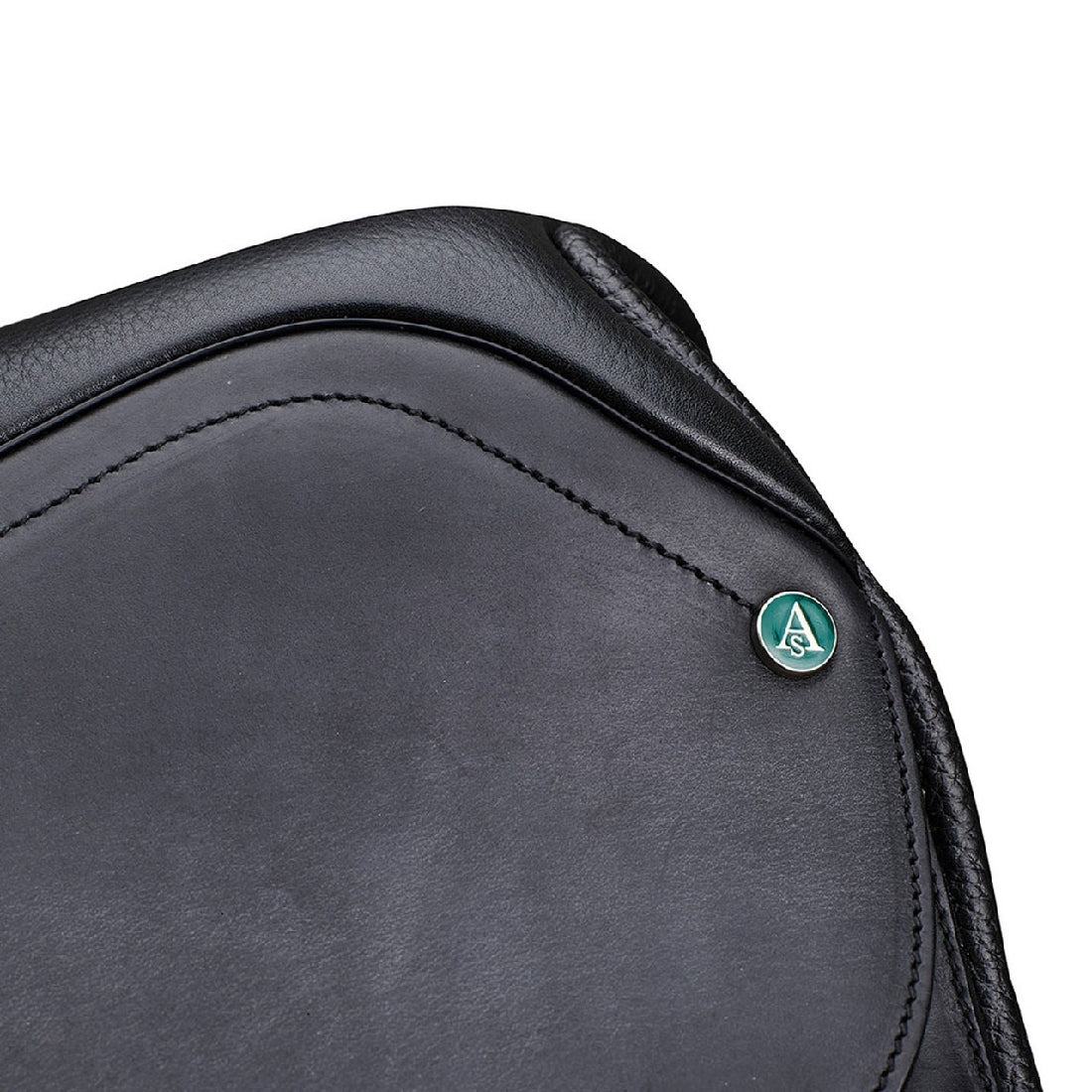 Close-up of black Arena Saddles logo on leather saddle surface.