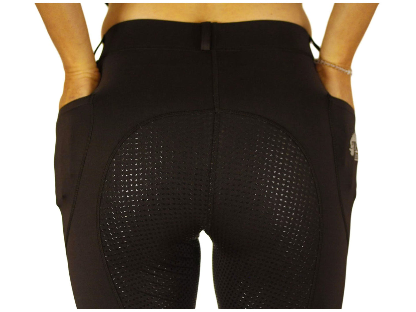Rear view of black horse riding tights with ventilated thigh panels.