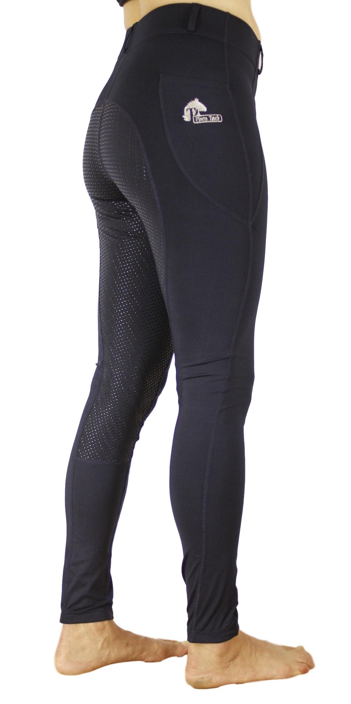 Person wearing navy blue horse riding tights with mesh panels.