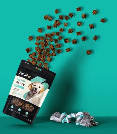 Zamipet Happy Treats dog snacks spilling from packet with toys.
