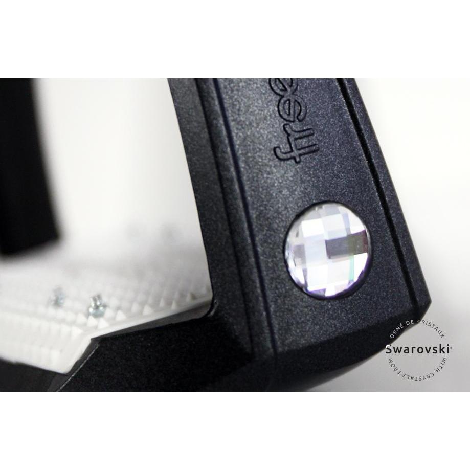 Black stirrup leathers with Swarovski crystal embellishment close-up view.