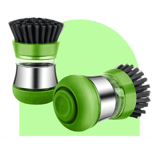 Two green and silver kitchen dish brushes with black bristles, one upright, one lying on its side, against a green and white background.