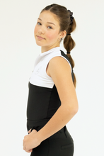 Person wearing a black and white outfit on a white background