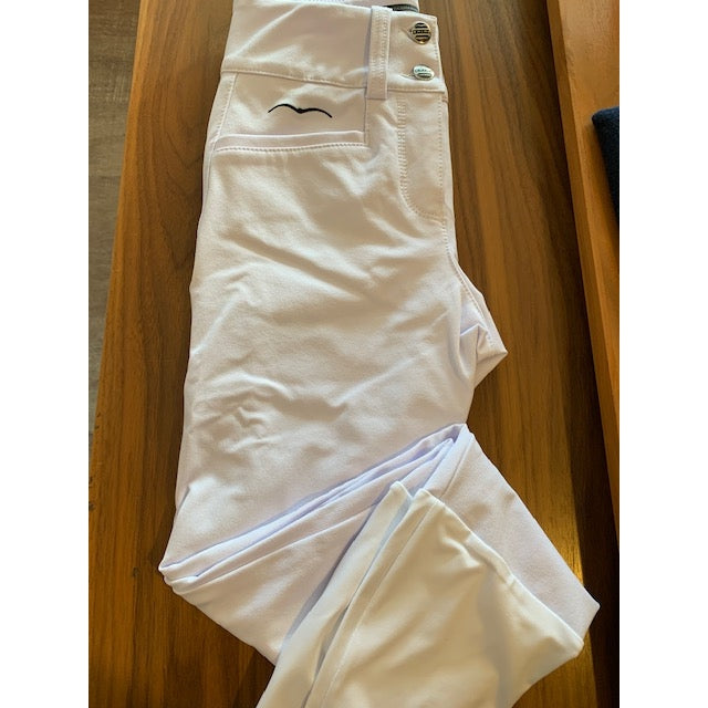 Alt: Animo brand white breeches laid out on wooden surface.