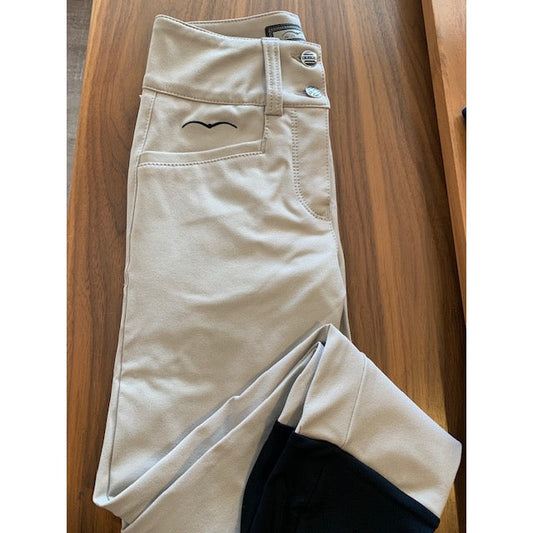 Animo brand beige riding breeches on wooden surface.