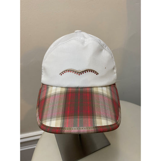 Animo brand cap with plaid brim and studded decoration on white fabric.