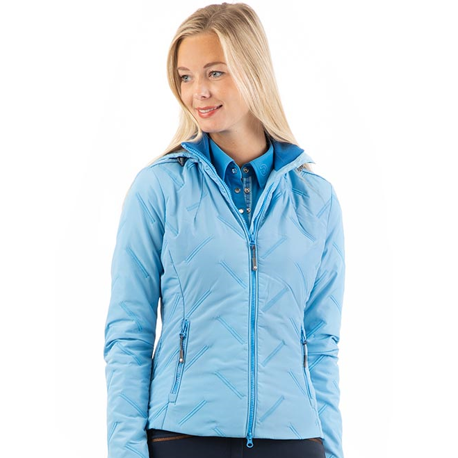 Woman wearing light blue ANKY equestrian jacket with zipper.