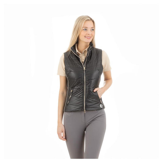 "ANKY brand quilted black equestrian vest on smiling woman."