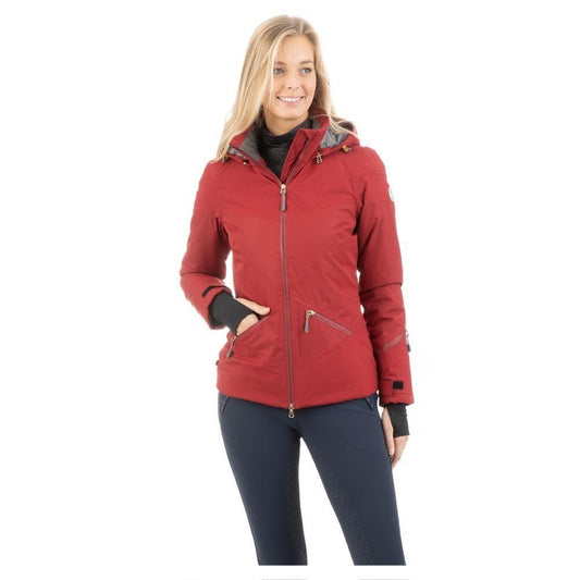 Woman modeling a red ANKY equestrian jacket with zipper details.