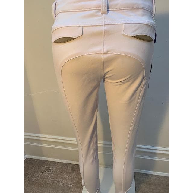 Anna Scarpati beige riding breeches with tan knee patches.