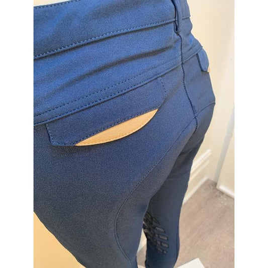 Close-up of Anna Scarpati blue riding breeches with tan detail.