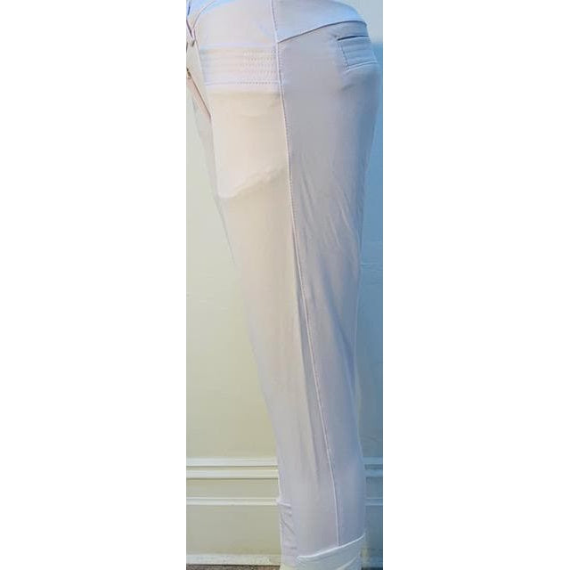 Alt text: Side view of white Anna Scarpati riding breeches against a light background.