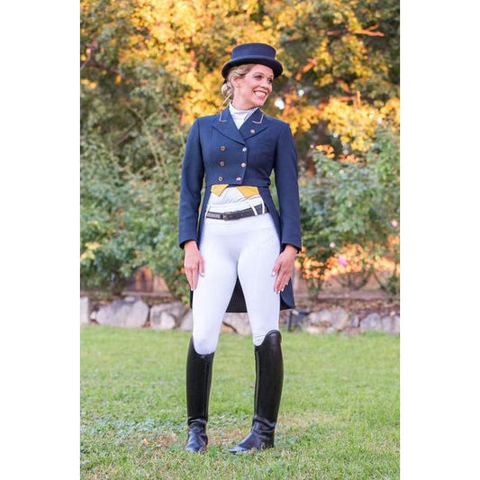 Woman in equestrian attire with horse riding tights, boots, and helmet.