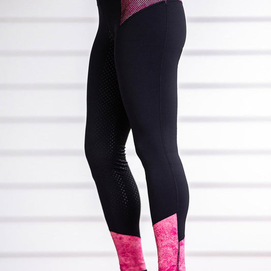 Black and pink horse riding tights against a white background.