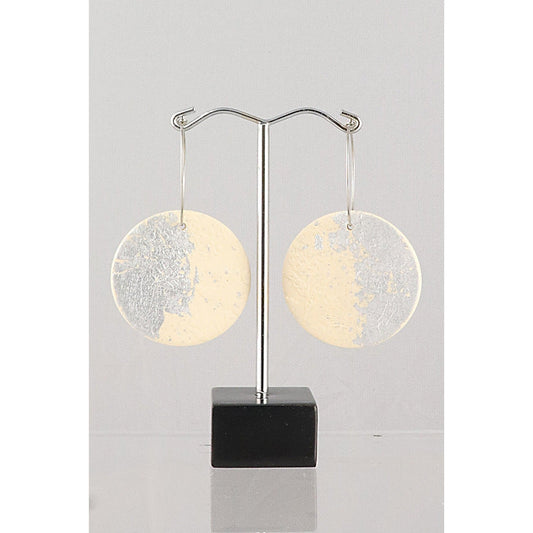 Round earrings on metal stand.