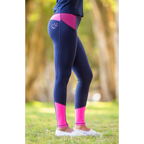 Person wearing stylish navy and pink horse riding tights outdoors.