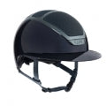 KASK brand black horse riding helmet with chin strap isolated.