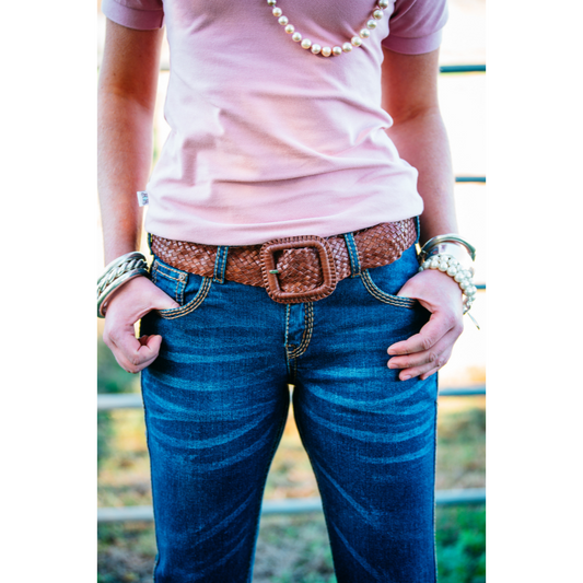 Person in jeans with belt.