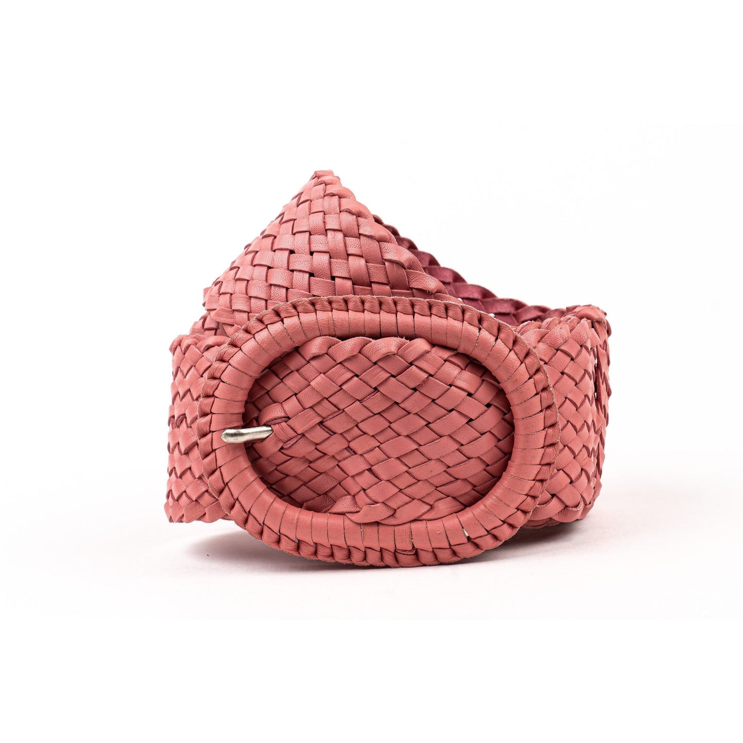 Woven pink leather belt coiled.
