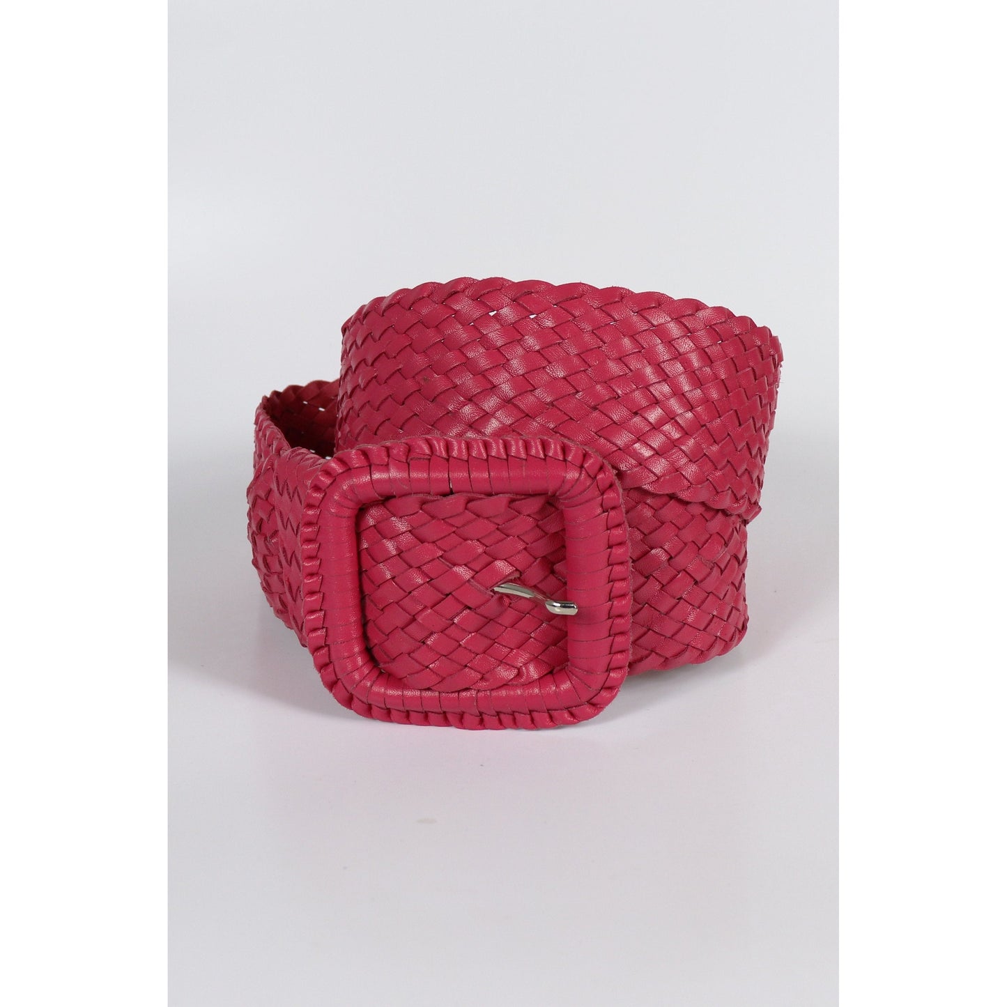 Red woven leather belt isolated.