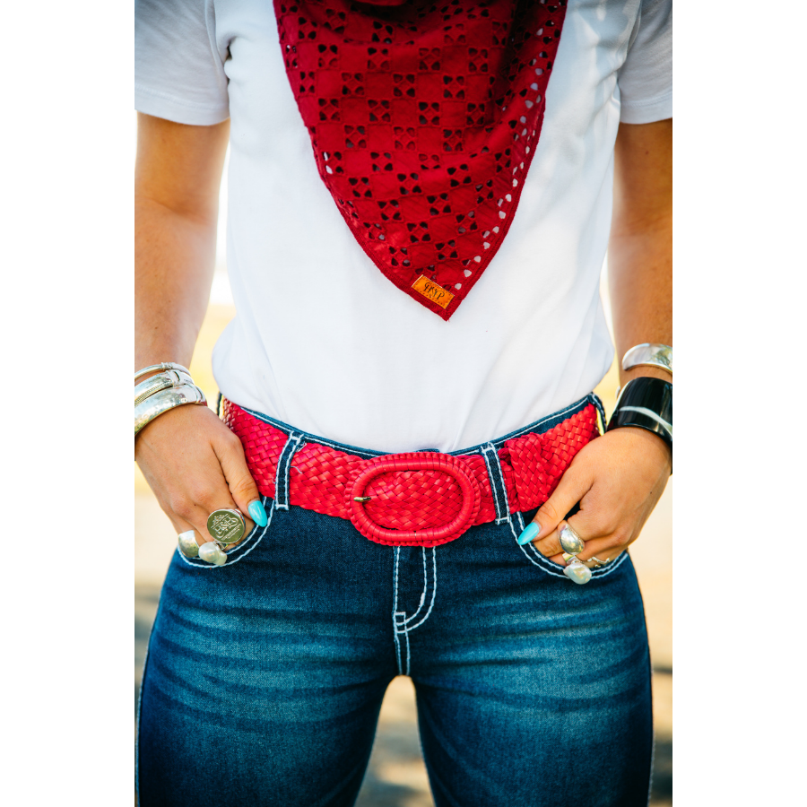 Person wearing red belt, bandana.
