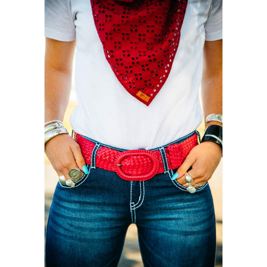 Person wearing red belt, bandana.
