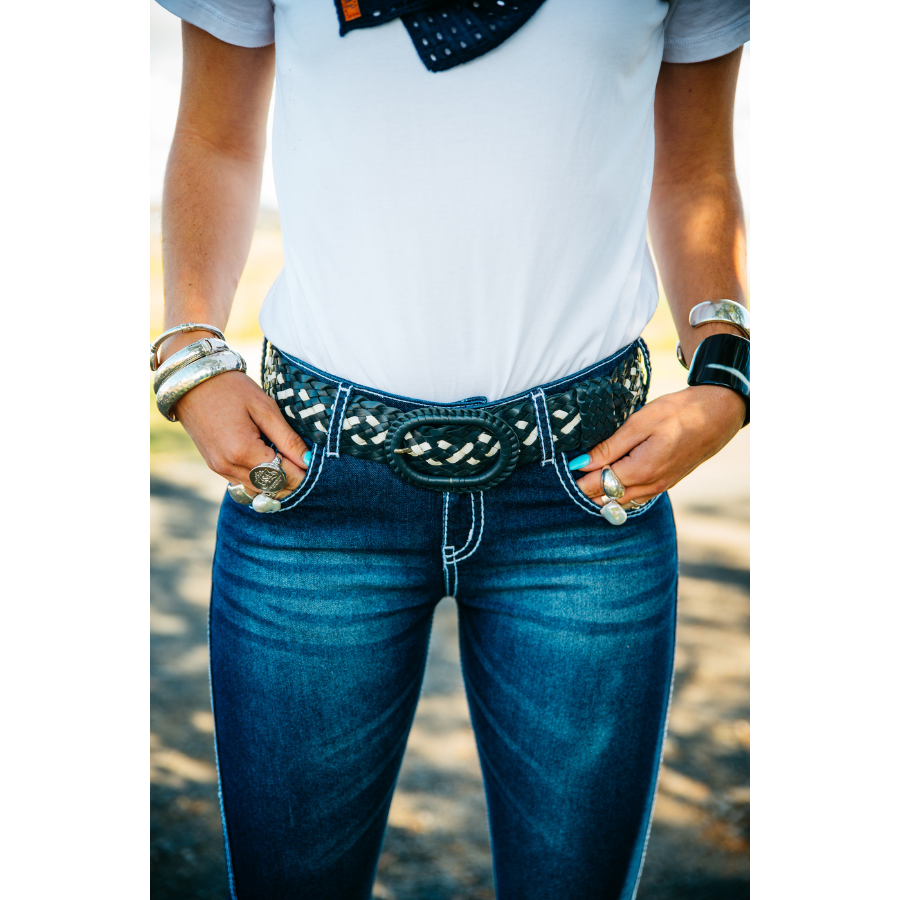 Woman wearing jeans and belt.