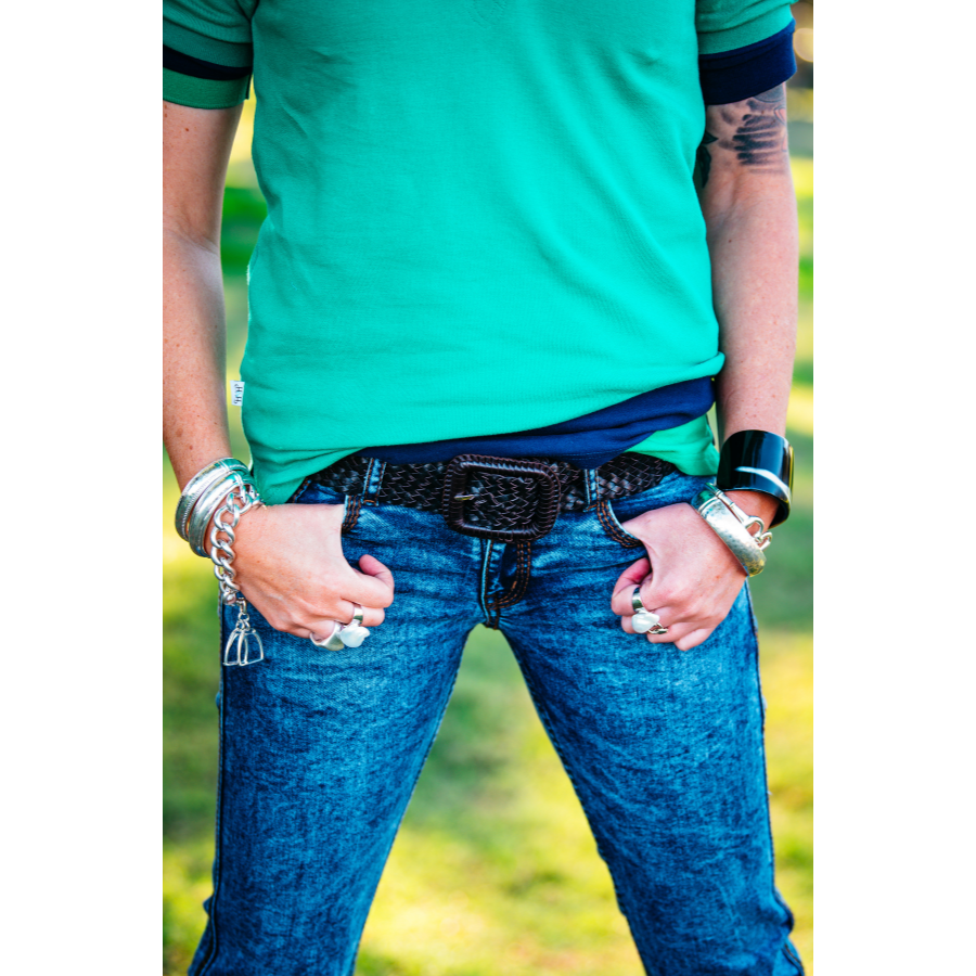 Person in jeans with accessories.
