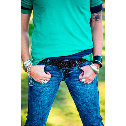 Person in jeans with accessories.