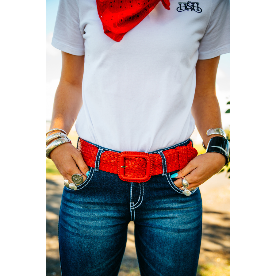 Person wearing red belt, jeans.