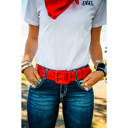 Person wearing red belt, jeans.