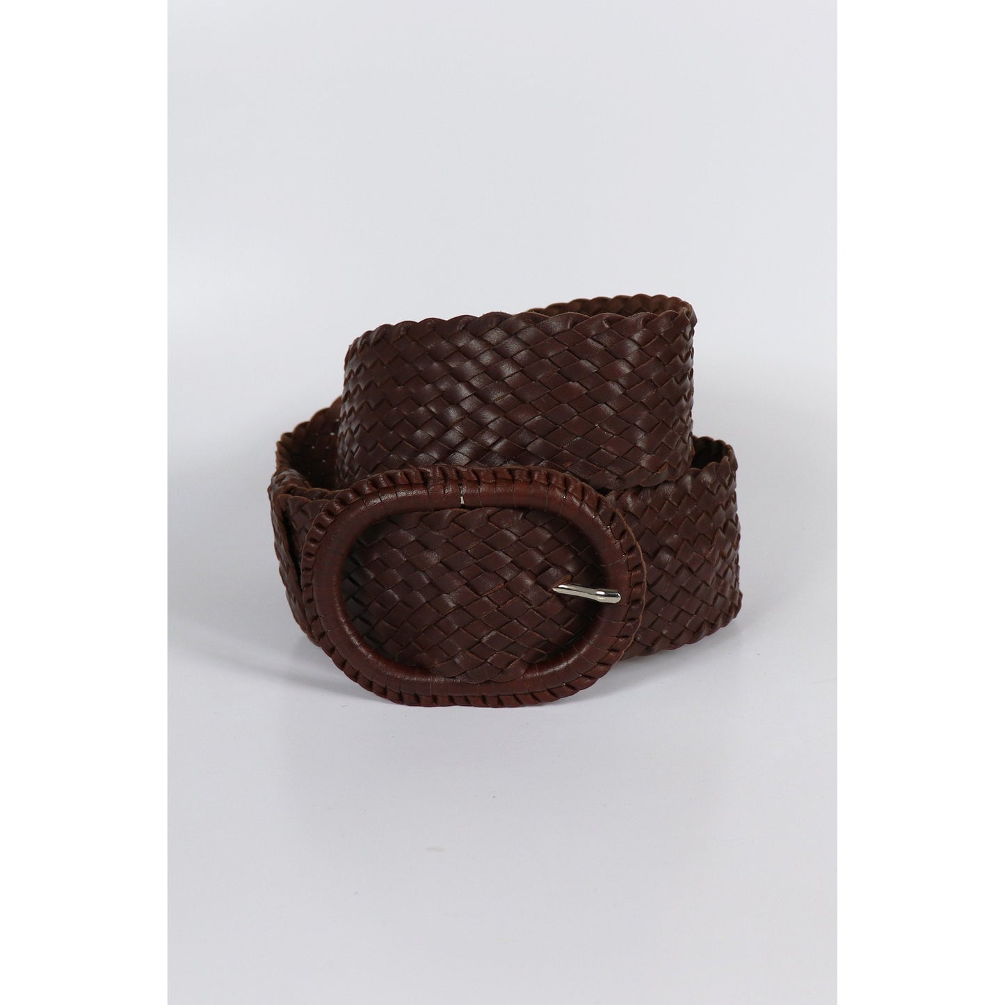 Brown woven leather belt coiled