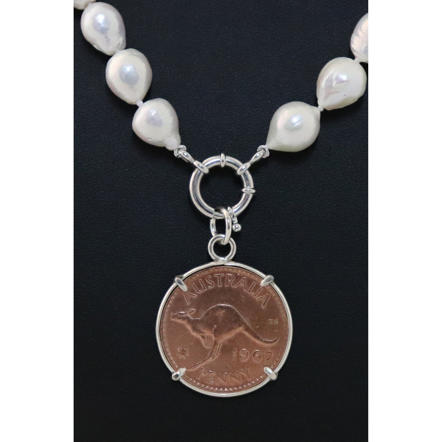 Pearl necklace with kangaroo coin pendant.