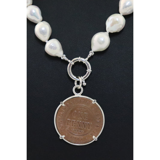Pearl necklace with penny pendant.