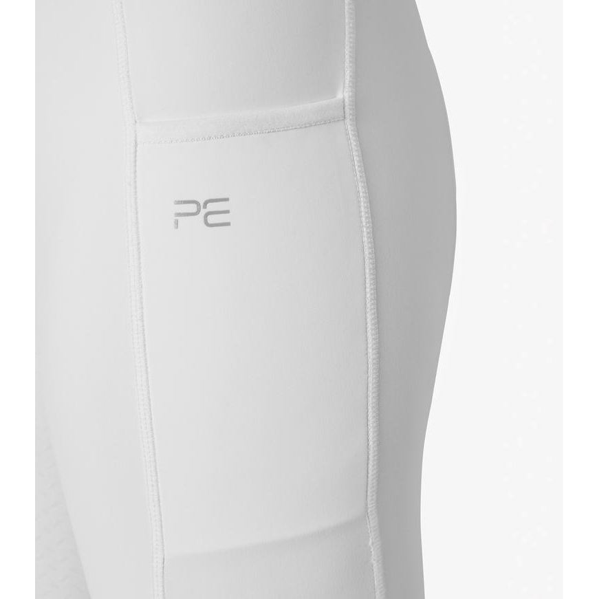 Close-up of white horse riding tights with stitched logo detail.