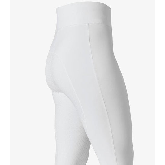 Close-up of white horse riding tights with textured knee patches.
