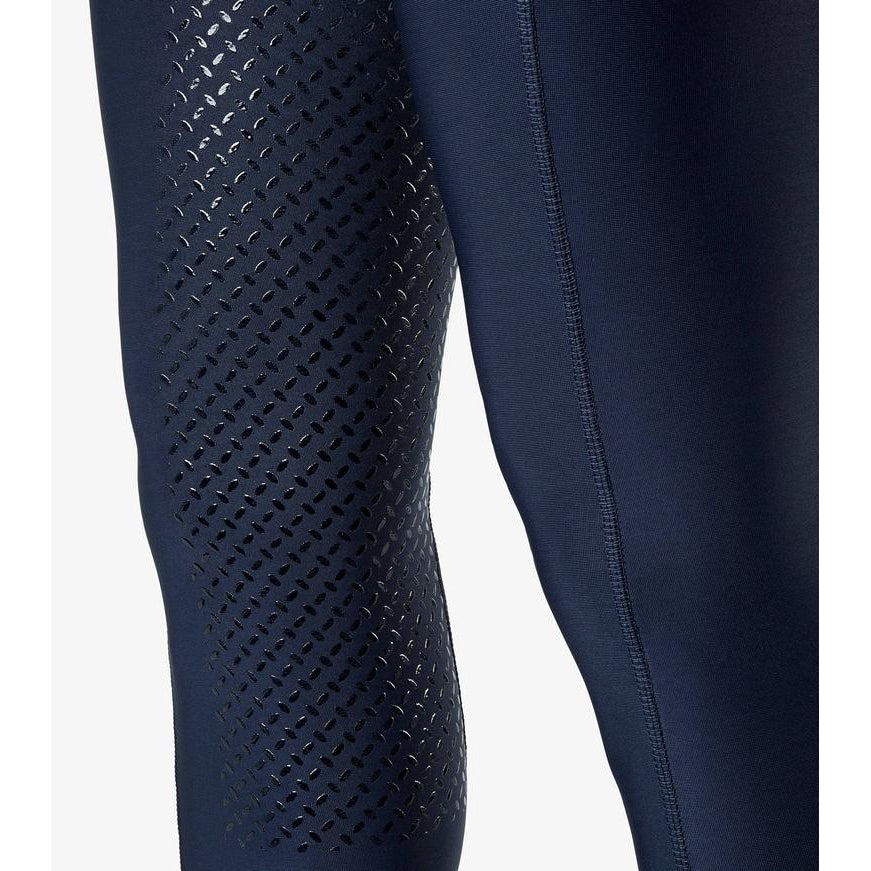 Close-up of navy horse riding tights with ventilated thigh panels.