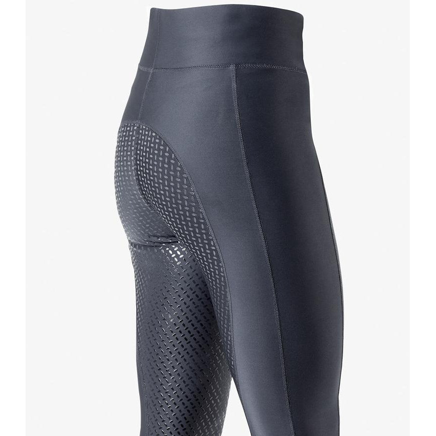 Close-up of gray horse riding tights with textured side panels.