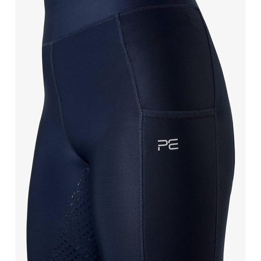 Close-up of navy blue horse riding tights with side pocket detail.