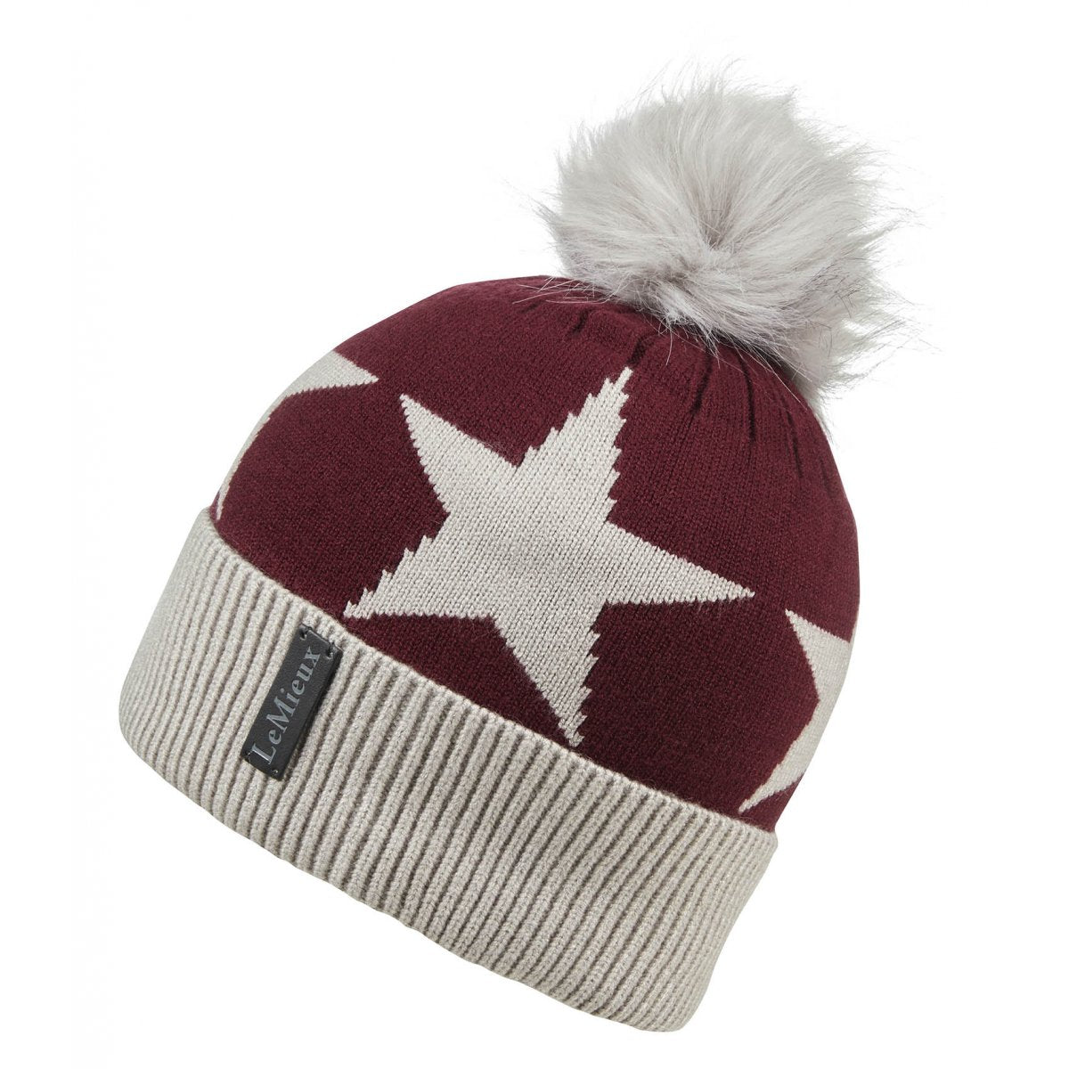 A maroon and cream Lemieux beanie with a star pattern and a fluffy pom-pom on top.