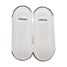 White Thinline horse boots with dotted texture, black trim.