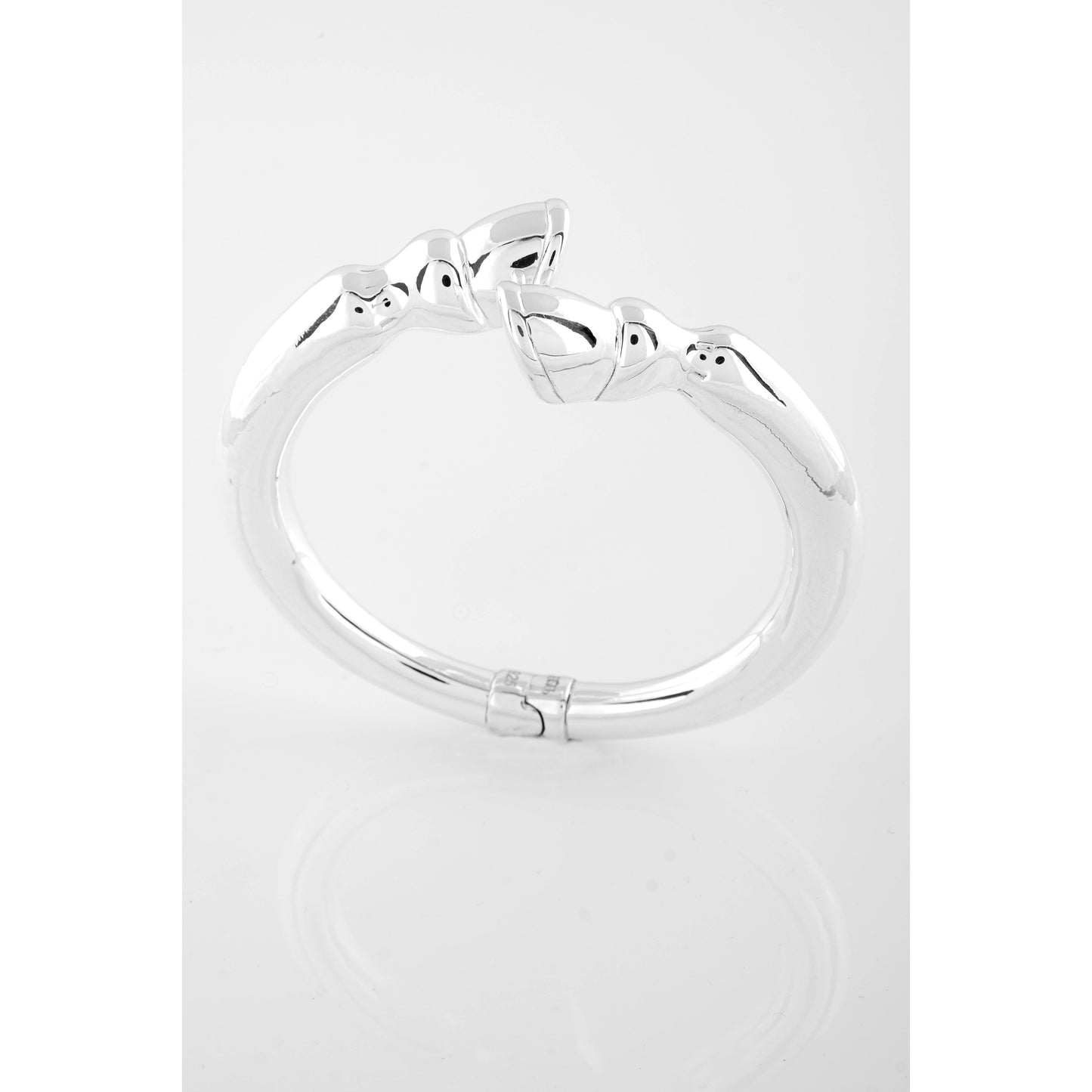 Silver bracelet with cat design.
