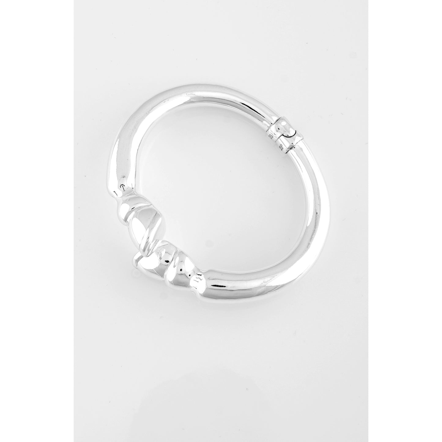 Silver circular hinged segment ring.