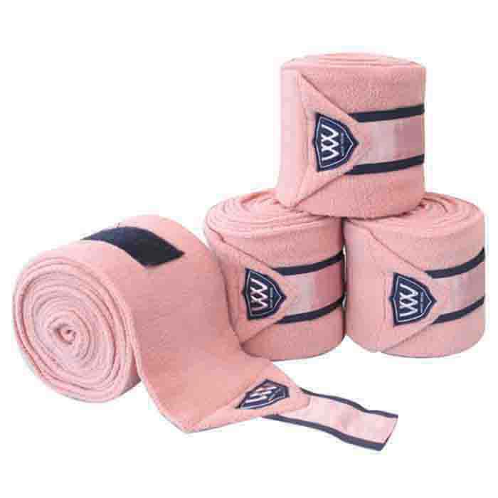 Four Woof Wear pink horse leg wraps with black and white logo.