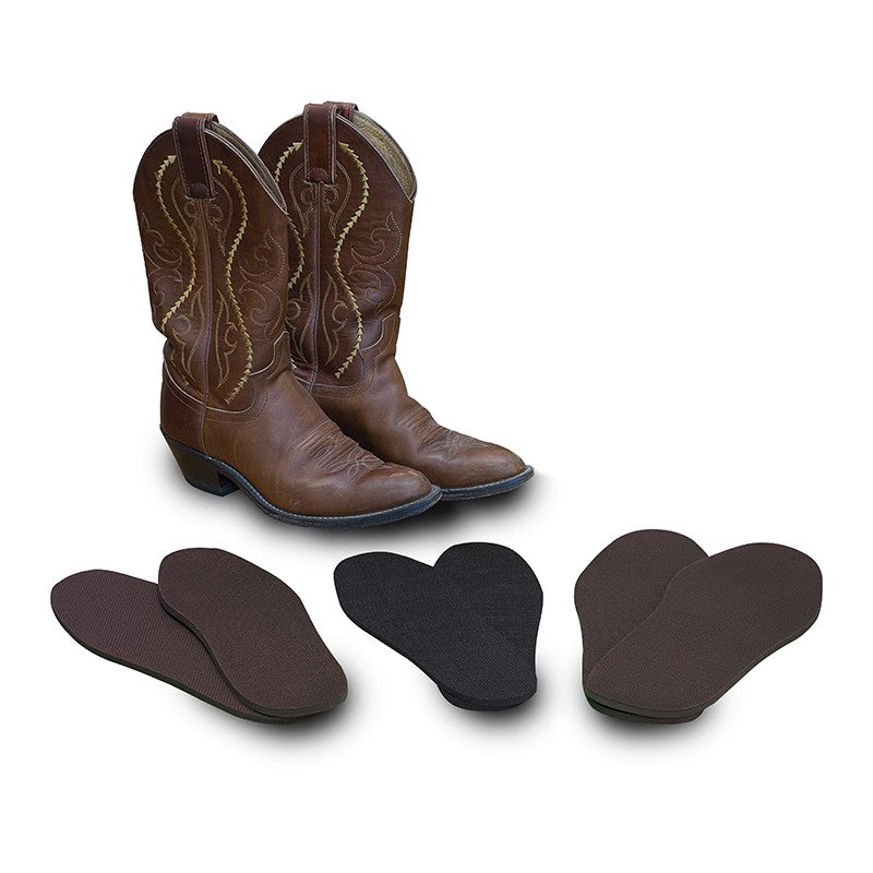 Thinline Global brown cowboy boots and assorted insoles on white background.