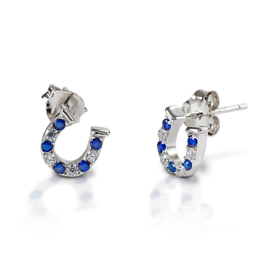 Kelly Herd silver horseshoe earrings with blue gemstones on white.